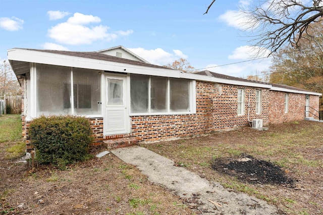 21 U St, Honea Path, SC 29654 - rear view of house with brick siding, a sunroom, and entry steps