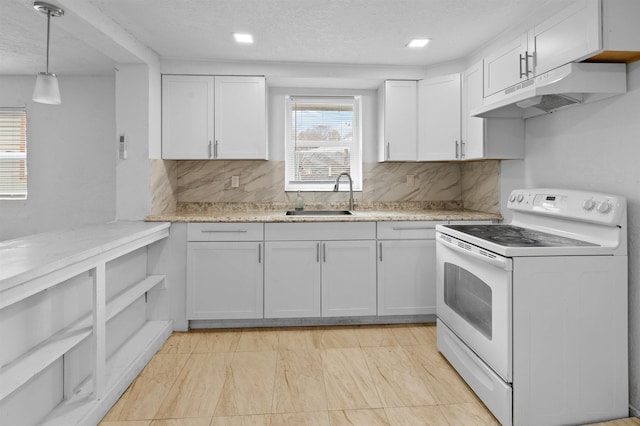 21 U St, Honea Path, SC 29654 - kitchen featuring white electric range oven, under cabinet range hood, decorative backsplash, white cabinets, and a textured ceiling