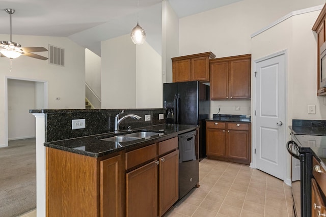 536 Goldstone Ln, Boiling Springs, SC 29336 - kitchen featuring ceiling fan, black appliances, vaulted ceiling, brown cabinets, and dark stone countertops