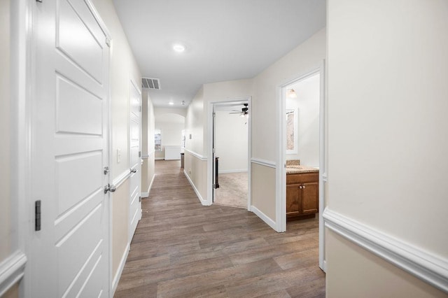 1135 Wanley Way, Boiling Springs, SC 29316 - hallway with arched walkways, wood finished floors, and recessed lighting