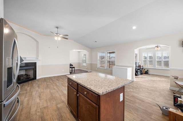 1135 Wanley Way, Boiling Springs, SC 29316 - kitchen with stainless steel fridge with ice dispenser, a ceiling fan, arched walkways, and lofted ceiling