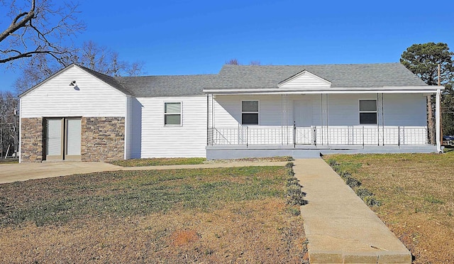 150 Cromer St, Roebuck, SC 29376 - view of front of property with a porch, a front yard, roof with shingles, and stone siding