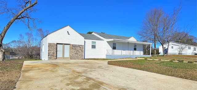 150 Cromer St, Roebuck, SC 29376 - view of front of property with stone siding, covered porch, and concrete driveway