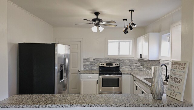 150 Cromer St, Roebuck, SC 29376 - kitchen featuring appliances with stainless steel finishes, ceiling fan, tasteful backsplash, light stone counters, and ornamental molding
