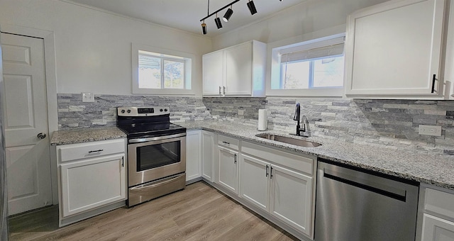 150 Cromer St, Roebuck, SC 29376 - kitchen featuring stainless steel appliances, white cabinetry, tasteful backsplash, light stone countertops, and ornamental molding