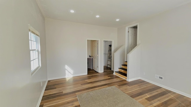 150 Cromer St, Roebuck, SC 29376 - spare room with wood finished floors, stairway, and recessed lighting