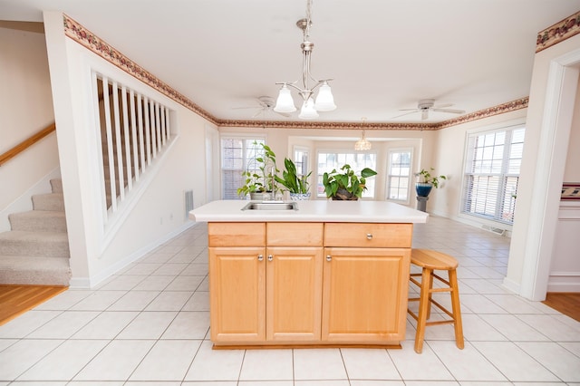1 Carnoustie Ct, Campobello, SC 29322 - kitchen with light tile patterned floors, light countertops, hanging light fixtures, a ceiling fan, and a kitchen bar