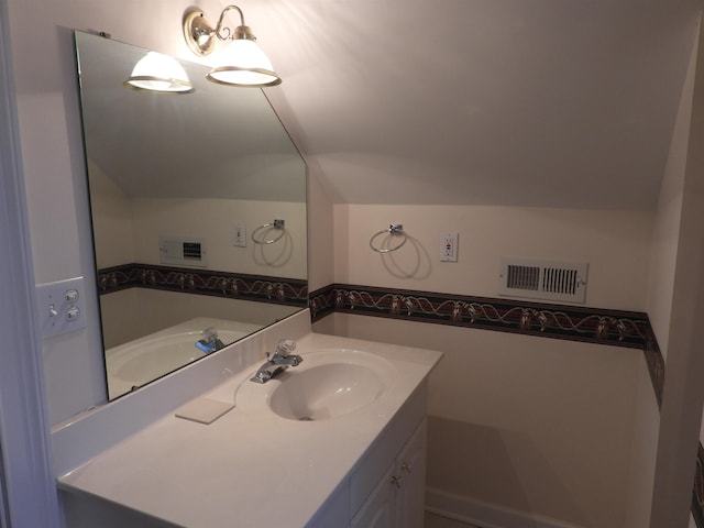 1 Carnoustie Ct, Campobello, SC 29322 - bathroom with vaulted ceiling and vanity