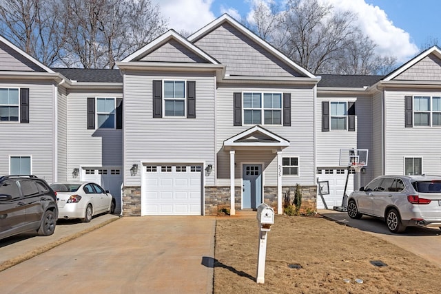 235 Marshland Ln, Greer, SC 29650 - view of property with driveway, an attached garage, and stone siding