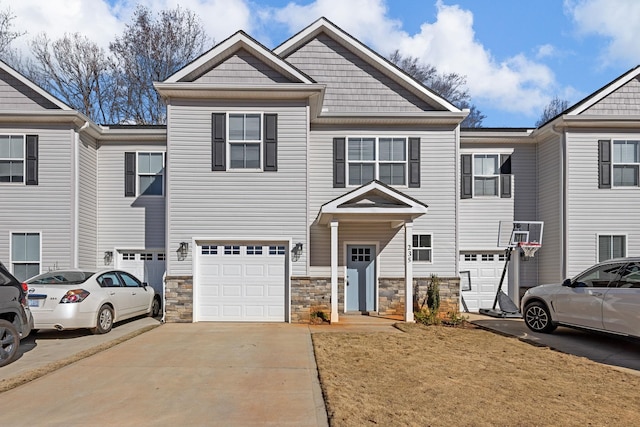 235 Marshland Ln, Greer, SC 29650 - view of property with driveway, an attached garage, and stone siding