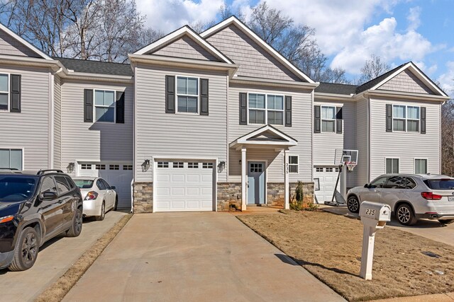 235 Marshland Ln, Greer, SC 29650 - view of property featuring driveway, a garage, and stone siding