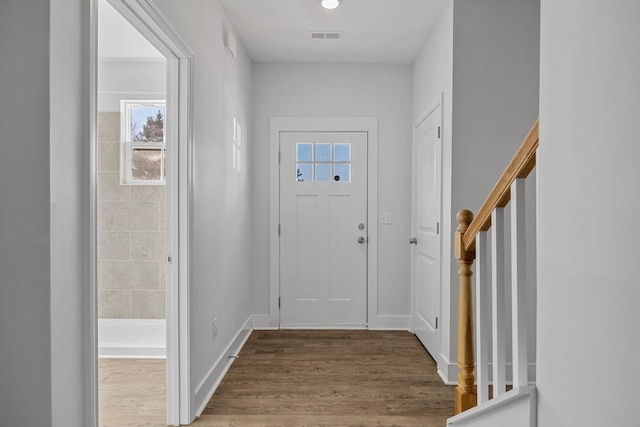 235 Marshland Ln, Greer, SC 29650 - foyer entrance with healthy amount of natural light, wood finished floors, stairway, and recessed lighting