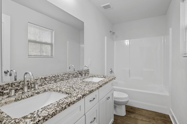 235 Marshland Ln, Greer, SC 29650 - full bath with double vanity, wood finished floors, and tub / shower combination