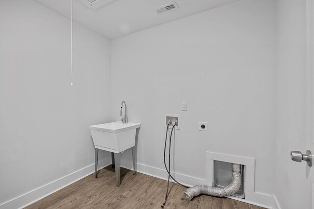 235 Marshland Ln, Greer, SC 29650 - laundry room with hookup for an electric dryer, hookup for a washing machine, and wood finished floors