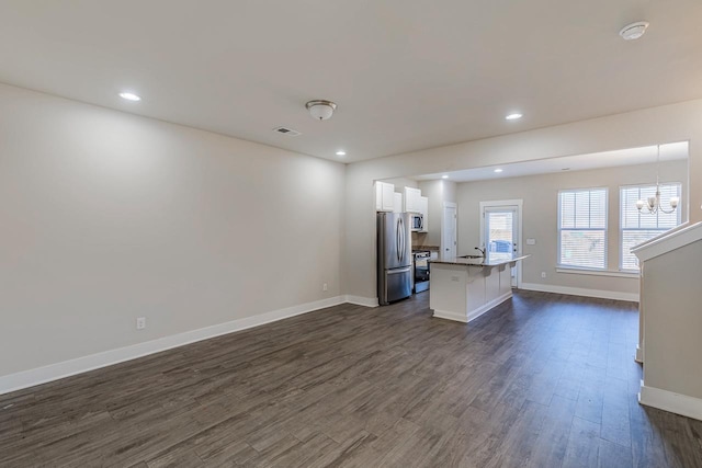 105 Lerner Ct, Spartanburg, SC 29301 - living area featuring dark wood finished floors, a chandelier, and recessed lighting