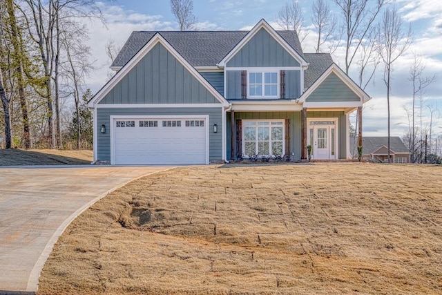 155 Chestnut Dr, Woodruff, SC 29388 - craftsman-style home featuring board and batten siding, driveway, a garage, and a shingled roof