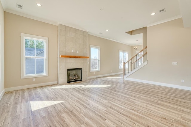 155 Chestnut Dr, Woodruff, SC 29388 - unfurnished living room with healthy amount of natural light, light wood-style flooring, ornamental molding, recessed lighting, and a fireplace
