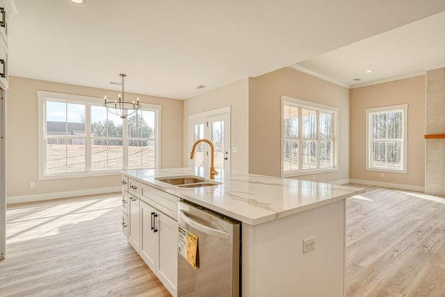 155 Chestnut Dr, Woodruff, SC 29388 - kitchen featuring dishwasher, light wood finished floors, light stone countertops, a center island with sink, and white cabinets