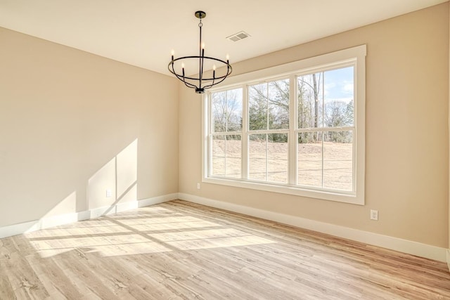 155 Chestnut Dr, Woodruff, SC 29388 - unfurnished dining area featuring a chandelier and light wood-type flooring
