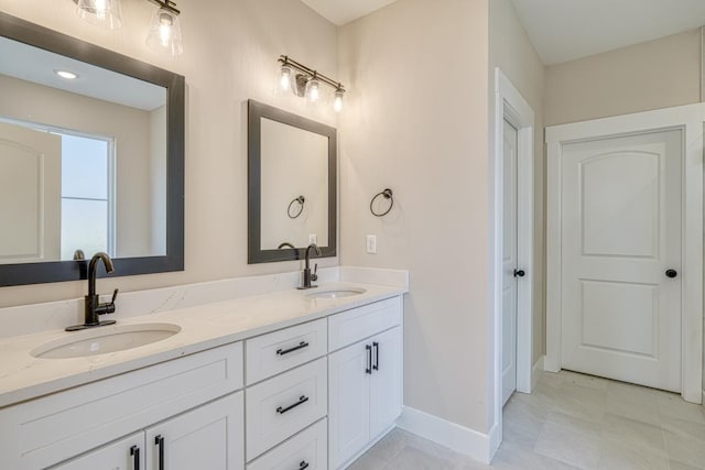 155 Chestnut Dr, Woodruff, SC 29388 - bathroom with double vanity and baseboards