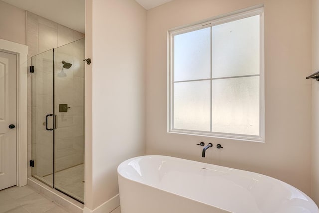 155 Chestnut Dr, Woodruff, SC 29388 - bathroom featuring a freestanding tub, a stall shower, and plenty of natural light