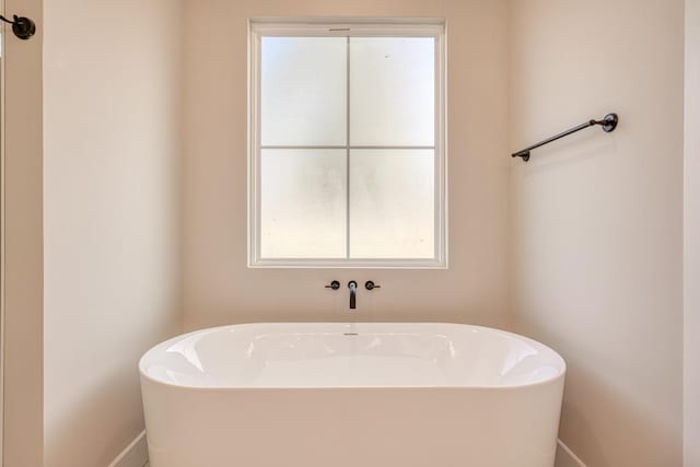 155 Chestnut Dr, Woodruff, SC 29388 - full bath featuring a freestanding tub and baseboards