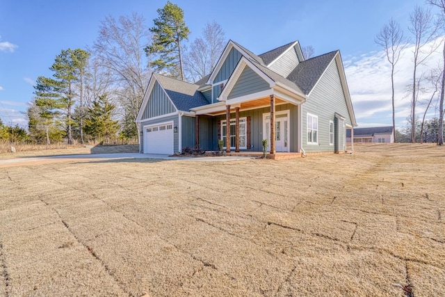 155 Chestnut Dr, Woodruff, SC 29388 - craftsman-style home featuring board and batten siding, covered porch, driveway, an attached garage, and roof with shingles