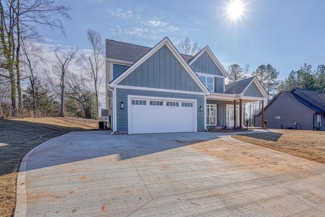 155 Chestnut Dr, Woodruff, SC 29388 - craftsman-style home featuring board and batten siding, concrete driveway, an attached garage, and covered porch