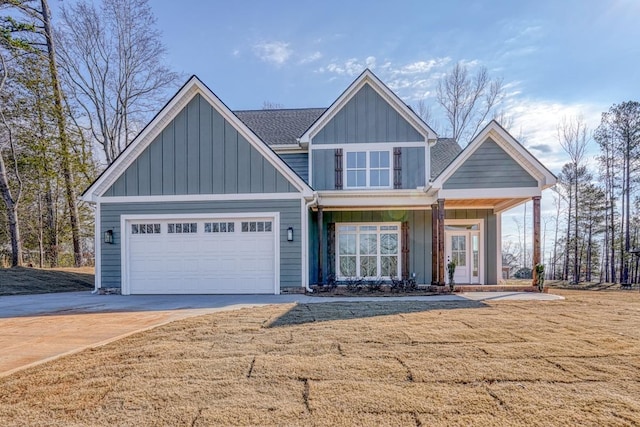 155 Chestnut Dr, Woodruff, SC 29388 - view of front of home with board and batten siding, concrete driveway, a front lawn, and an attached garage