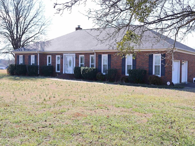 101 Sheraton Loop, Gaffney, SC 29341 - view of front facade featuring brick siding, a chimney, and a front yard
