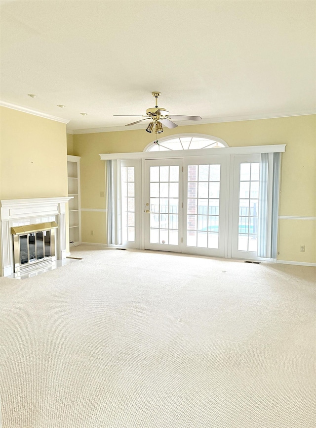 101 Sheraton Loop, Gaffney, SC 29341 - unfurnished living room featuring carpet floors, crown molding, a ceiling fan, and plenty of natural light
