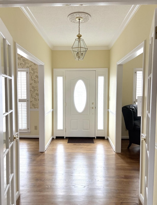 101 Sheraton Loop, Gaffney, SC 29341 - foyer entrance with wood finished floors, crown molding, and a textured ceiling