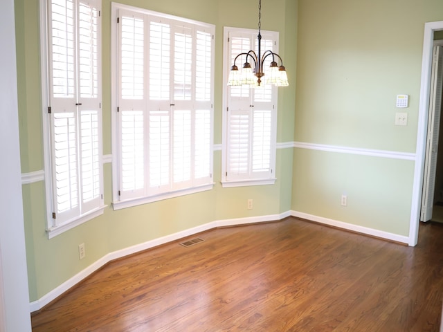 101 Sheraton Loop, Gaffney, SC 29341 - unfurnished dining area with a chandelier and wood finished floors