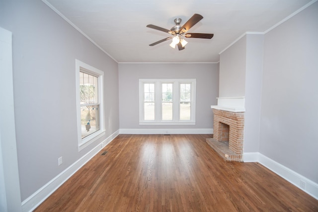 708 E Main St, Union, SC 29379 - unfurnished living room with healthy amount of natural light, wood finished floors, a fireplace, a ceiling fan, and crown molding