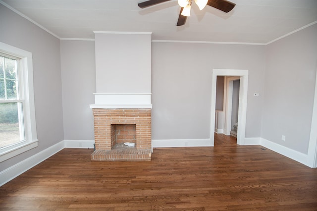 708 E Main St, Union, SC 29379 - unfurnished living room with ceiling fan, wood finished floors, ornamental molding, and a brick fireplace