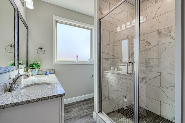 139 Floyd Meadow Dr, Inman, SC 29349 - bathroom with double vanity, a shower stall, and wood finished floors