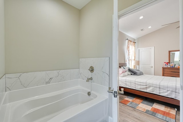 139 Floyd Meadow Dr, Inman, SC 29349 - ensuite bathroom with a bath, lofted ceiling, vanity, wood finished floors, and recessed lighting