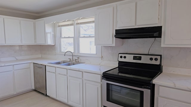 210 James St, Union, SC 29379 - kitchen featuring appliances with stainless steel finishes, under cabinet range hood, white cabinets, decorative backsplash, and crown molding