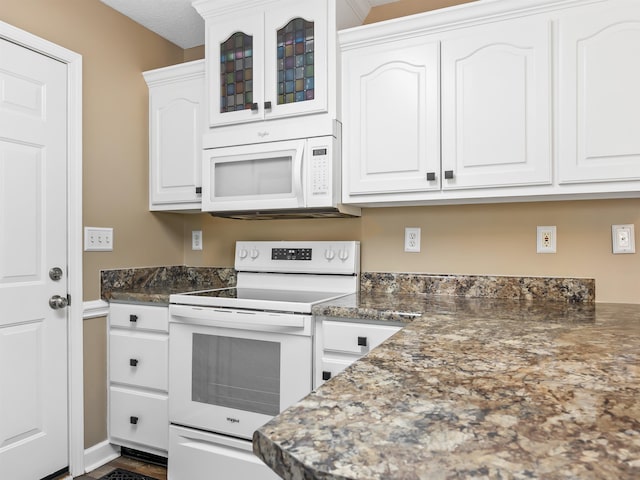 160 Blake Garrison Dr, Roebuck, SC 29376 - kitchen featuring white appliances, white cabinets, and glass insert cabinets