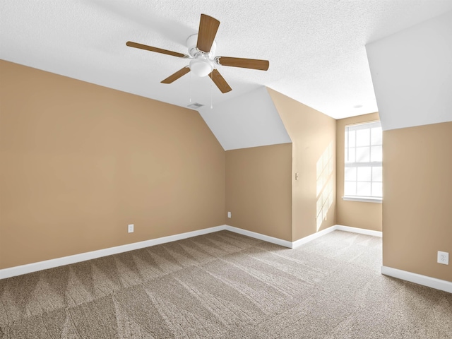 160 Blake Garrison Dr, Roebuck, SC 29376 - additional living space with lofted ceiling, carpet flooring, ceiling fan, and a textured ceiling