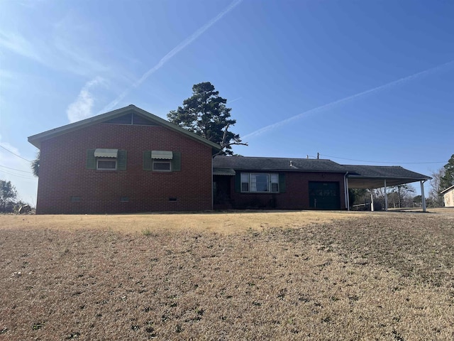 513 Peach Orchard Rd, Union, SC 29379 - rear view of property featuring brick siding, an attached carport, and crawl space