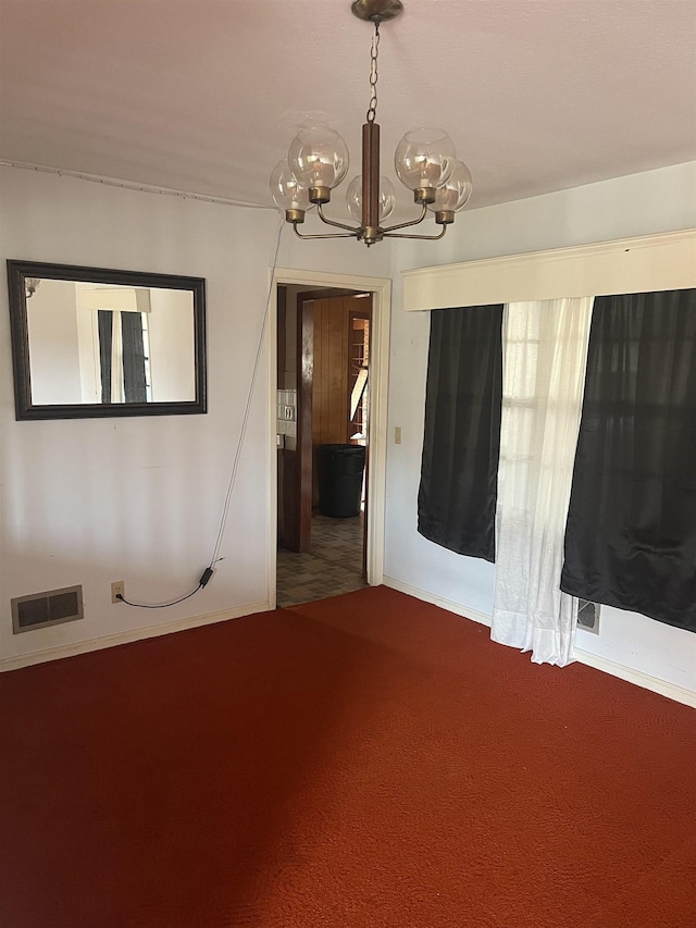 513 Peach Orchard Rd, Union, SC 29379 - spare room with a chandelier and carpet floors