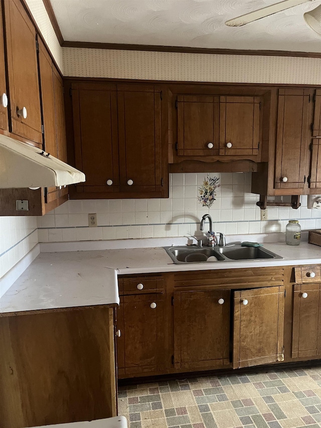 513 Peach Orchard Rd, Union, SC 29379 - kitchen featuring light countertops, tasteful backsplash, range hood, ornamental molding, and wallpapered walls