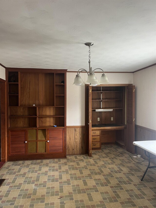 513 Peach Orchard Rd, Union, SC 29379 - unfurnished office with wooden walls, wainscoting, and built in desk