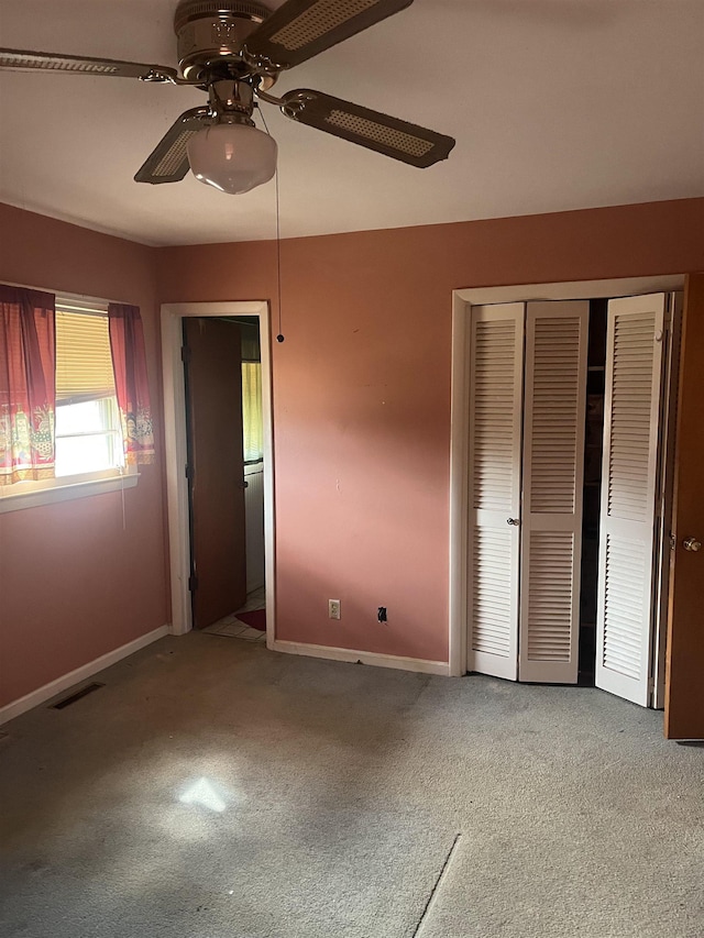 513 Peach Orchard Rd, Union, SC 29379 - unfurnished bedroom featuring carpet, a closet, and a ceiling fan
