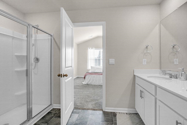 14 Sunriff Ct, Greer, SC 29651 - bathroom featuring vanity, a stall shower, connected bathroom, and vaulted ceiling