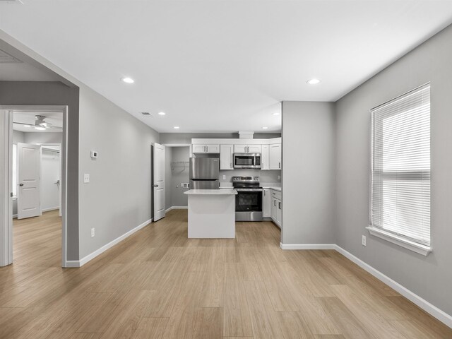 218 Caulder Cir, Spartanburg, SC 29306 - kitchen featuring appliances with stainless steel finishes, a kitchen island, light wood-style floors, light countertops, and recessed lighting