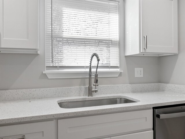 218 Caulder Cir, Spartanburg, SC 29306 - kitchen featuring dishwasher, white cabinets, and light stone countertops