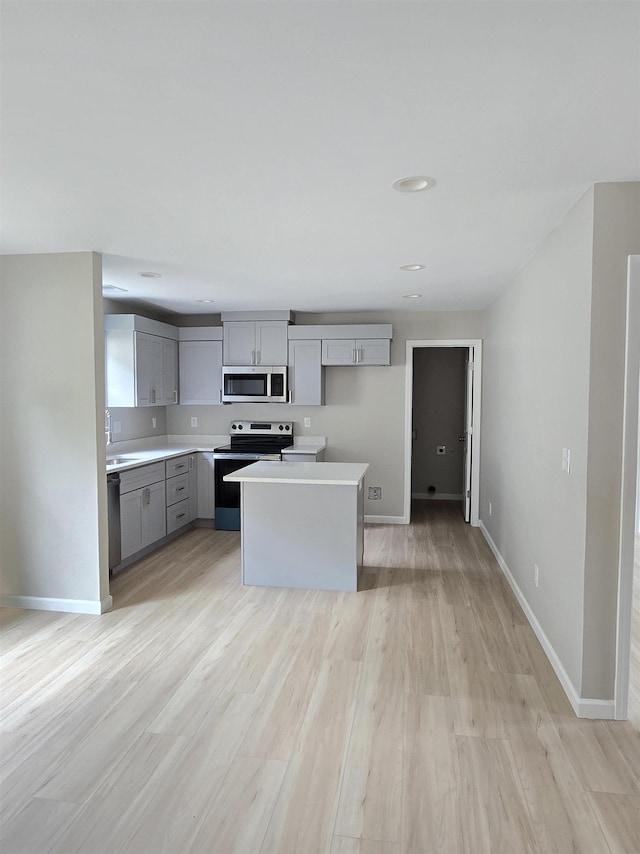218 Caulder Cir, Spartanburg, SC 29306 - kitchen featuring appliances with stainless steel finishes, gray cabinets, light countertops, light wood-style flooring, and recessed lighting