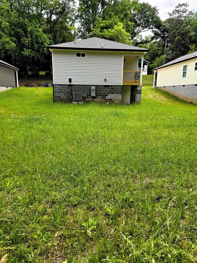 218 Caulder Cir, Spartanburg, SC 29306 - rear view of property with crawl space, view of wooded area, and a lawn
